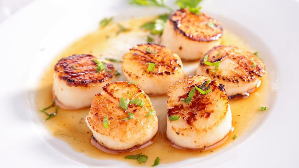 Broiled Deep Sea Scallops · Broiled deep sea scallops with lemon butter sauce.