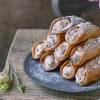 Fresh Baked Cannoli · Baked pastry dough filled with creamy filling.