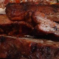 Bbq Ribs · Slow smoked to perfection. 
Served with your choice  of sides
Four ribs W/meal.