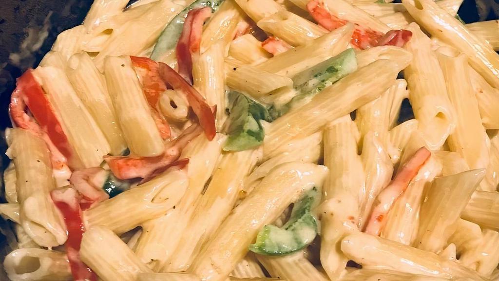 Rasta Pasta · Truly delicious and creamy, Made from our own secret blend of herbs, sweet peppers and  cheese sauce!