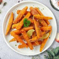 Sweet Spuds · Thick-cut sweet potato wedges fried until golden brown.