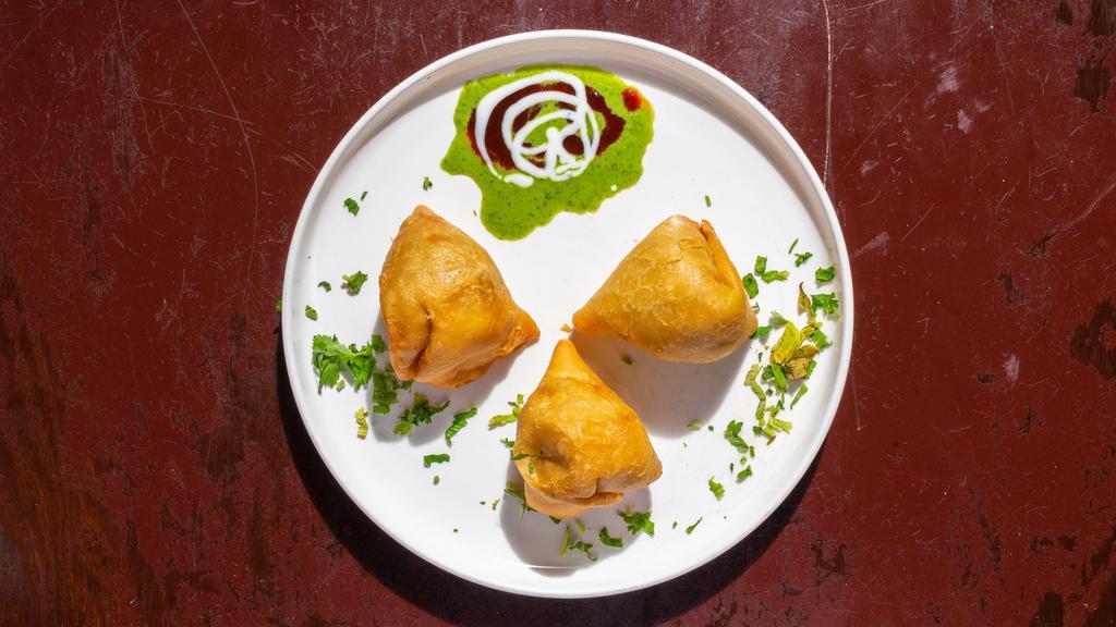 Samosa · Triangular turnovers filled with potatoes and green peas