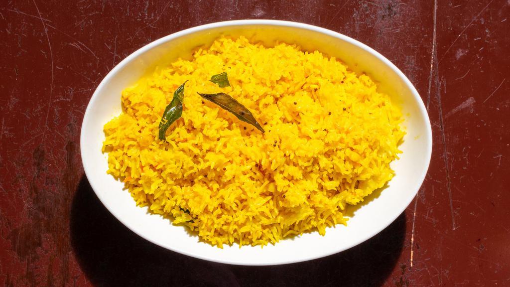 Benarsi Rice · Lemon flavored rice with a hint of peanuts & curry leaves