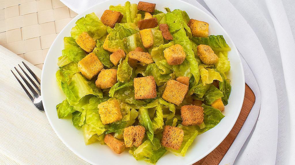 Caesar Salad (Small) · Crisp romaine lettuce topped with garlic croutons, aged pecorino cheese. All tossed with our own caesar dressing.