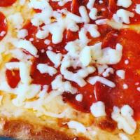 Grandma Pizza · A thin crust square pizza covered with mozzarella and splashed with imported San Marzano tom...