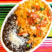 Rice And Beans · Refried Pinto Beans, Rice, Pico de Gallo and Queso Fresco.
