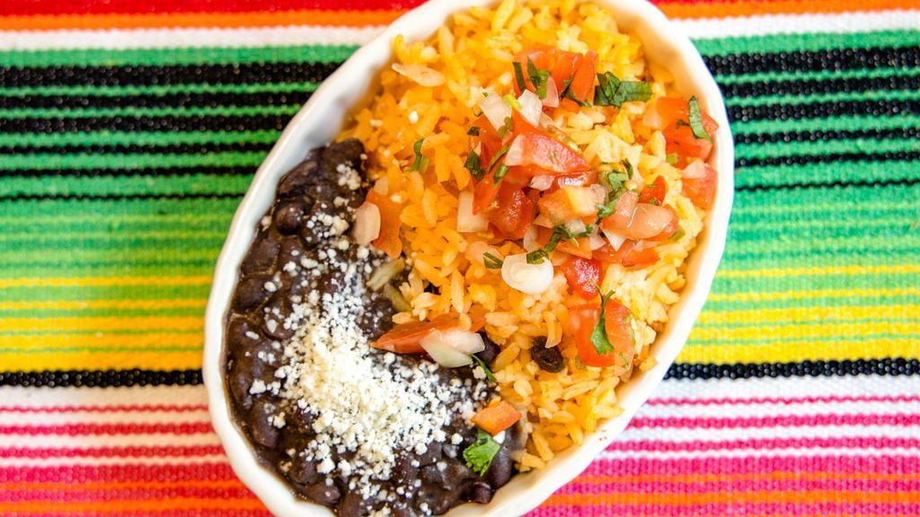 Rice And Beans · Refried Pinto Beans, Rice, Pico de Gallo and Queso Fresco.