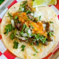 Carne Asada Taco · Grilled Steak, Cilantro, Pickle Red Onions and Smoked Morita Sauce.