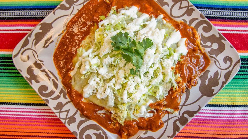 Enchiladas · Three Corn Tortillas Filled with Chicken, Pork or Beef, Red, Green Salsa or Mole Sauce. Served with Rice and Beans, Cream and Cotija Cheese.