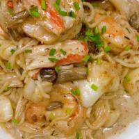 Seafood -Tofu Spaghetti · Roasted garlic. mushroom cream sauce with shrimp ,scallop ,snow crab ,squid.