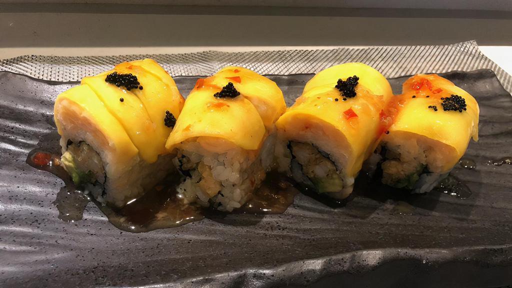 Mido Dragon Roll · Shrimp tempura & avocado
Top with lobster salad, mango
& black tobiko, Mango chili sauce