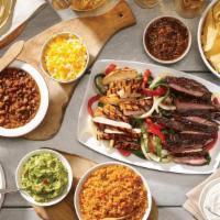 Family Fajita Meal For 4 · Chips and salsa, choice of queso or guacamole. Mesquite grilled steak and chicken or carnita...