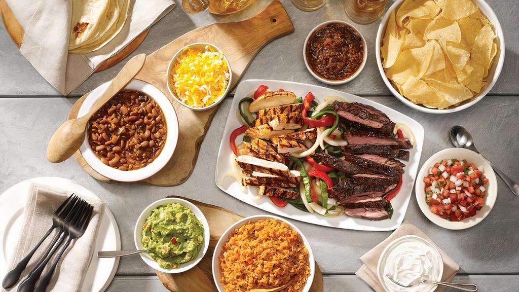 Family Fajita Meal For 4 · Chips and salsa, choice of queso or guacamole. Mesquite grilled steak and chicken or carnitas fajitas and our homemade flour tortillas, sour cream, cheese, pico de gallo, Mexican rice, beans, sauteed peppers and onions, plus a dozen churros for dessert
