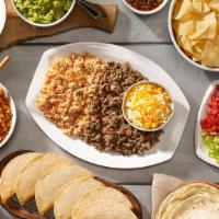 Family Taco Meal For 4 · Chips and salsa, choice of queso or guacamole. Ground beef and pulled chicken with our homem...