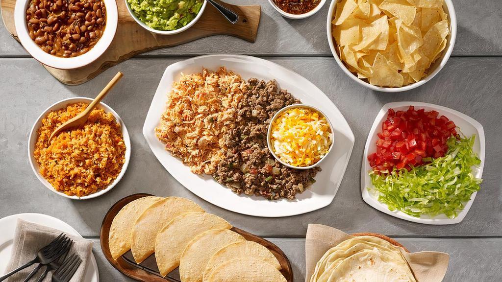 Family Taco Meal For 4 · Chips and salsa, choice of queso or guacamole. Ground beef and pulled chicken with our homemade flour tortillas or crispy taco shells. Lettuce, tomatoes, cheese, Mexican rice and beans, plus a dozen churros for dessert.