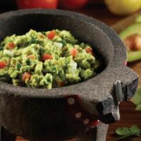 Guacamole · Made in-house with fresh Hass avocados,. Onions, cilantro, tomatoes and jalapenos.  Served w...
