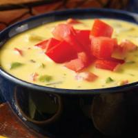 Chile Con Queso · Spicy blend of cheeses.