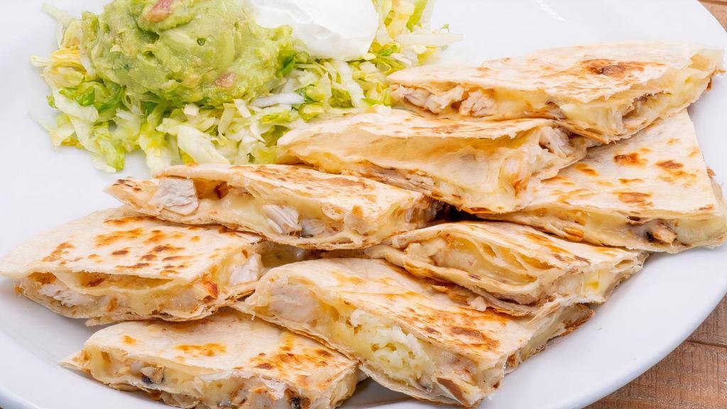 Fajita Quesadilla · Steak or Chicken Fajita, sautéed onions and Monterrey jack on flour tortillas with sour cream and fresh guacamole.