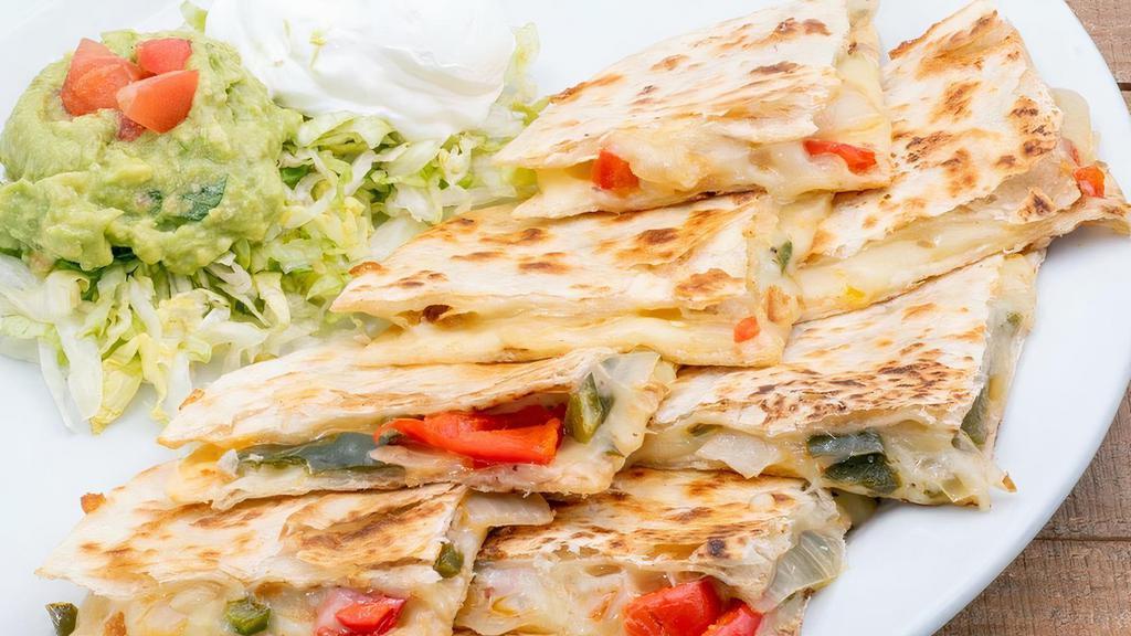 Vegetable Quesadilla · Sautéed peppers, onions, and Monterey Jack on flour tortillas with sour cream and fresh guacamole.