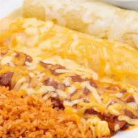 Combination Enchiladas · Choose two or three enchiladas: ground beef, pulled chicken or cheese & onion. Served with M...