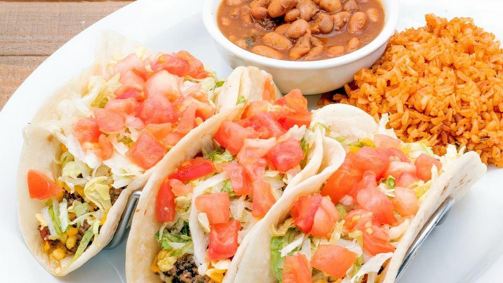 Soft Taco Plate · Choose between two or three pulled chicken, ground beef, mesquite grilled fajita chicken or beef tacos with lettuce, tomato, and shredded cheese.  Served with Mexican rice and frijoles a la charra.