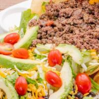 Classic Taco Salad · Choose from: ground beef, pulled or fajita chicken on a bed of fresh romaine lettuce. Topped...
