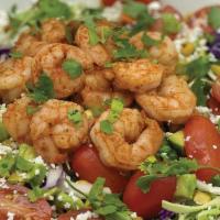 Fresca Salad · Seasoned shrimp served chilled atop a mix of greens and cabbage, with carrots, roasted corn,...