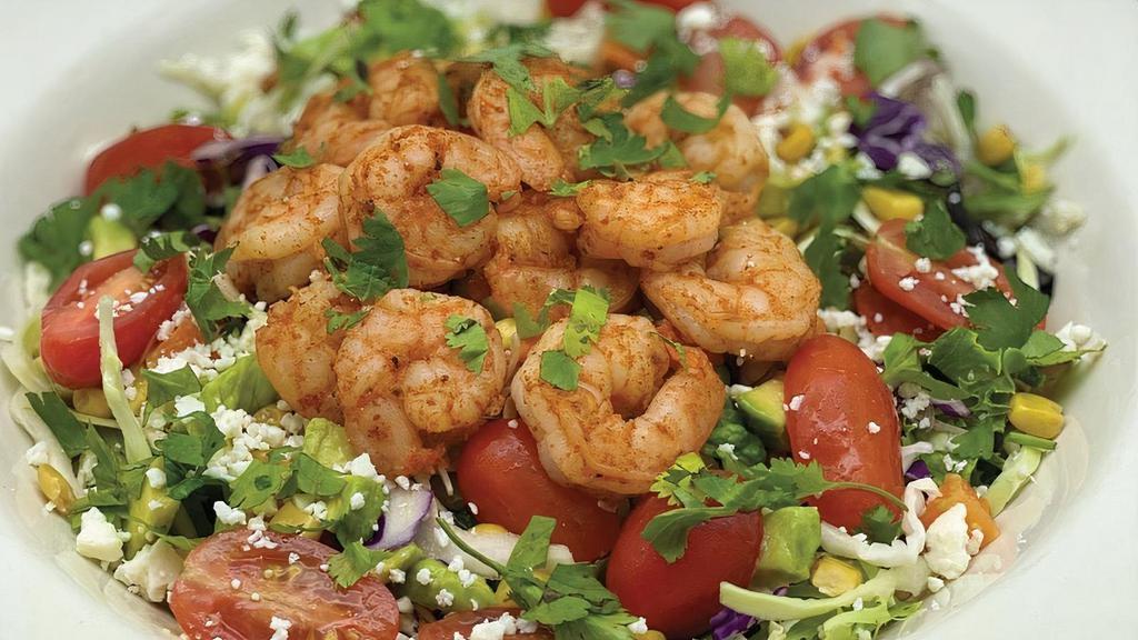 Fresca Salad · Seasoned shrimp served chilled atop a mix of greens and cabbage, with carrots, roasted corn, tomatoes, avocado escabeche & cotija cheese. . Choice of: Ranch, Jalapeño Ranch and Herb Vinaigrette
