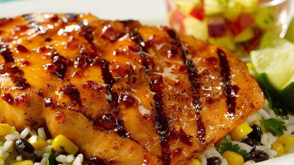Honey Chipotle Salmon · Mesquite grilled salmon filet topped with honey chipotle glaze served with Cilantro rice, homemade pico de gallo and black beans