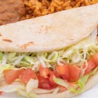 Kid Crispy Or Soft Taco  · Single beef or chicken taco with lettuce, tomato, and cheese. Served. with rice and refried ...