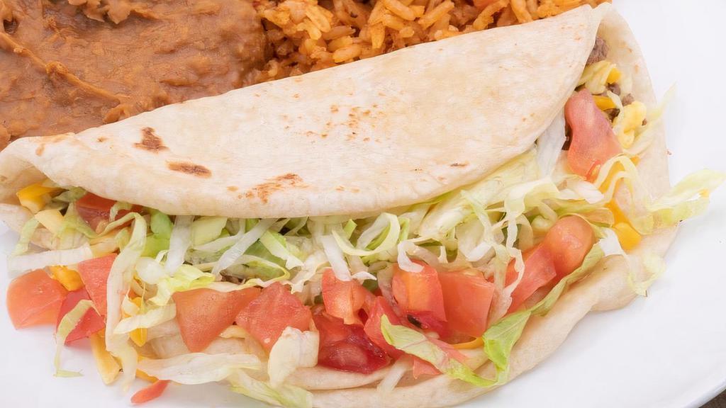 Kid Crispy Or Soft Taco  · Single beef or chicken taco with lettuce, tomato, and cheese. Served. with rice and refried beans..