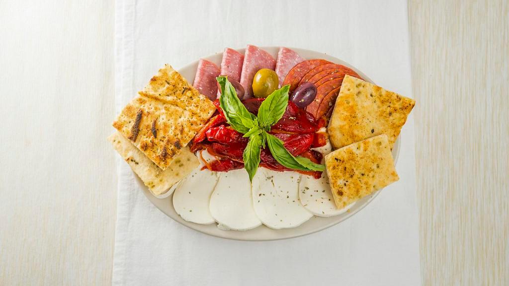 Antipasto #2 · Fresh Mozzarella cheese, roasted red peppers, pepperoni, salami, and olives. Served with garlic bread.