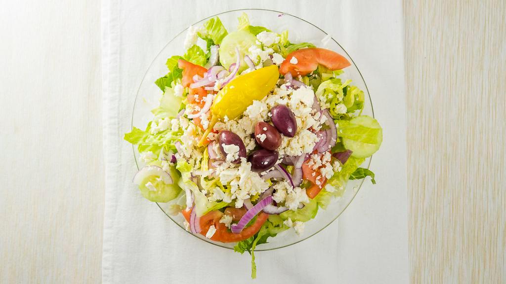 Greek Salad · Romaine lettuce, tomatoes, cucumbers, red onions, kalamata olives, Feta cheese and pepperoncini.