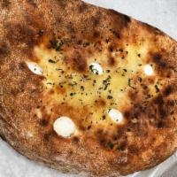 Calzone · Fresh ricotta cheese and homemade fresh Mozzarella cheese, baked in our brick oven and serve...