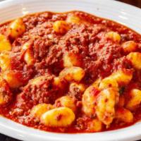 Gnocchi Bolognese · Freshly made gnocchi in a slow simmered tomato based meat sauce.