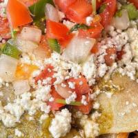 Pulled Pork Enchiladas · Roasted pulled pork rolled in corn tortillas, topped with salsa verde, queso fresco and pico...
