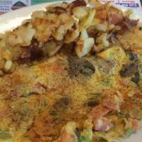 Garden Omelet · An abundance of fresh green peppers, mushrooms, onions, and tomato.