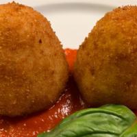 Arancini · Rice balls stuffed with mozzarella, ground beef, plum tomato sauce