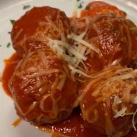 Polpettine · Our baked veal and beef meatballs with our plum tomato sauce, parmigiana reggiano