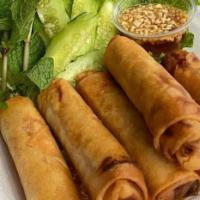 Veg Spring Rolls (Crispy) · Deep-fried golden spring rolls stuffed with taro, carrots, long rice and spices served with ...
