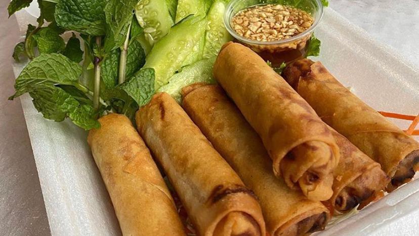 Veg Spring Rolls (Crispy) · Deep-fried golden spring rolls stuffed with taro, carrots, long rice and spices served with slices of fresh cucumber, mint leaves, lettuce and house sweet & sour sauce with peanuts(6 rolls).