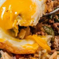 Thai Loco Moco (Pad Kapau) Medium Spice · Stir fried in a sizzling wok with sweet basil, bell peppers and onions. Served over rice and...