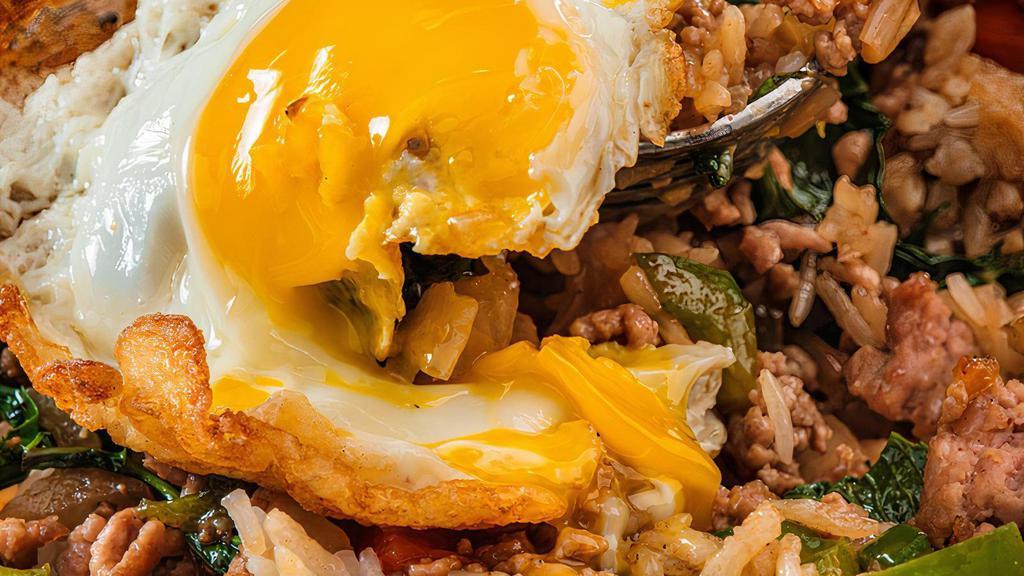 Thai Loco Moco (Pad Kapau) Medium Spice · Stir fried in a sizzling wok with sweet basil, bell peppers and onions. Served over rice and topped with an over easy egg. (Medium spice)