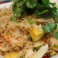 Pineapple Fried Rice · Rice fried with egg, onion, tomato, and pineapple.