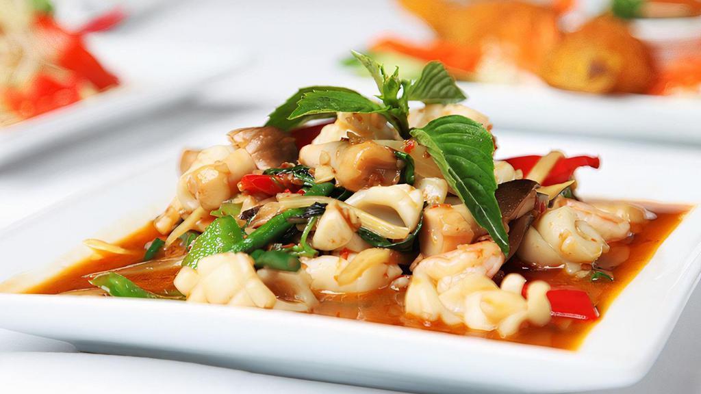 Spicy Seafood Combo (Pad Ped Hom Mid) · A combination of tiger shrimp, scallops and calamari sautéed in our sizzling wok flavored with chili, garlic, onions, bell peppers, bamboo shoots, mushrooms, long bean, and fresh basil.