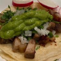 Carnitas Taco · Fried Pork, Corn Tortilla, Guacamole, Cilantro, Onion, Side Of Radish, And Lime