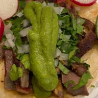 Lengua Taco · Beef Tongue, Corn Tortilla, Guacamole, Cilantro, Onion, Side Of Radish, And Lime