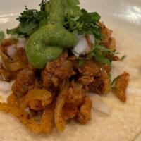 Carne  Enchilada Taco · Spicy Pork, Corn Tortilla, Guacamole, Cilantro, And Onion, Side Of Radish, And Lime