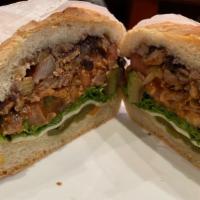 Al Pastor Torta  · Spicy Pork With Pineapple, Lettuce, Tomato, Mayonnaise, Avocado, Black Beans, Fried Cheese, ...
