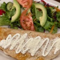 Quesadilla · Corn dough Quesadilla topped with sour cream, cotija cheese served with choice of avocado sa...